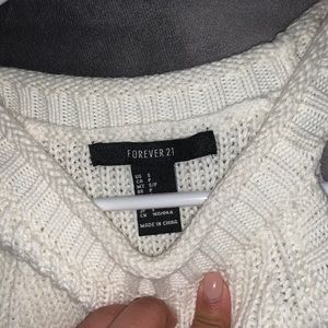 White sweater with cropped out shoulders